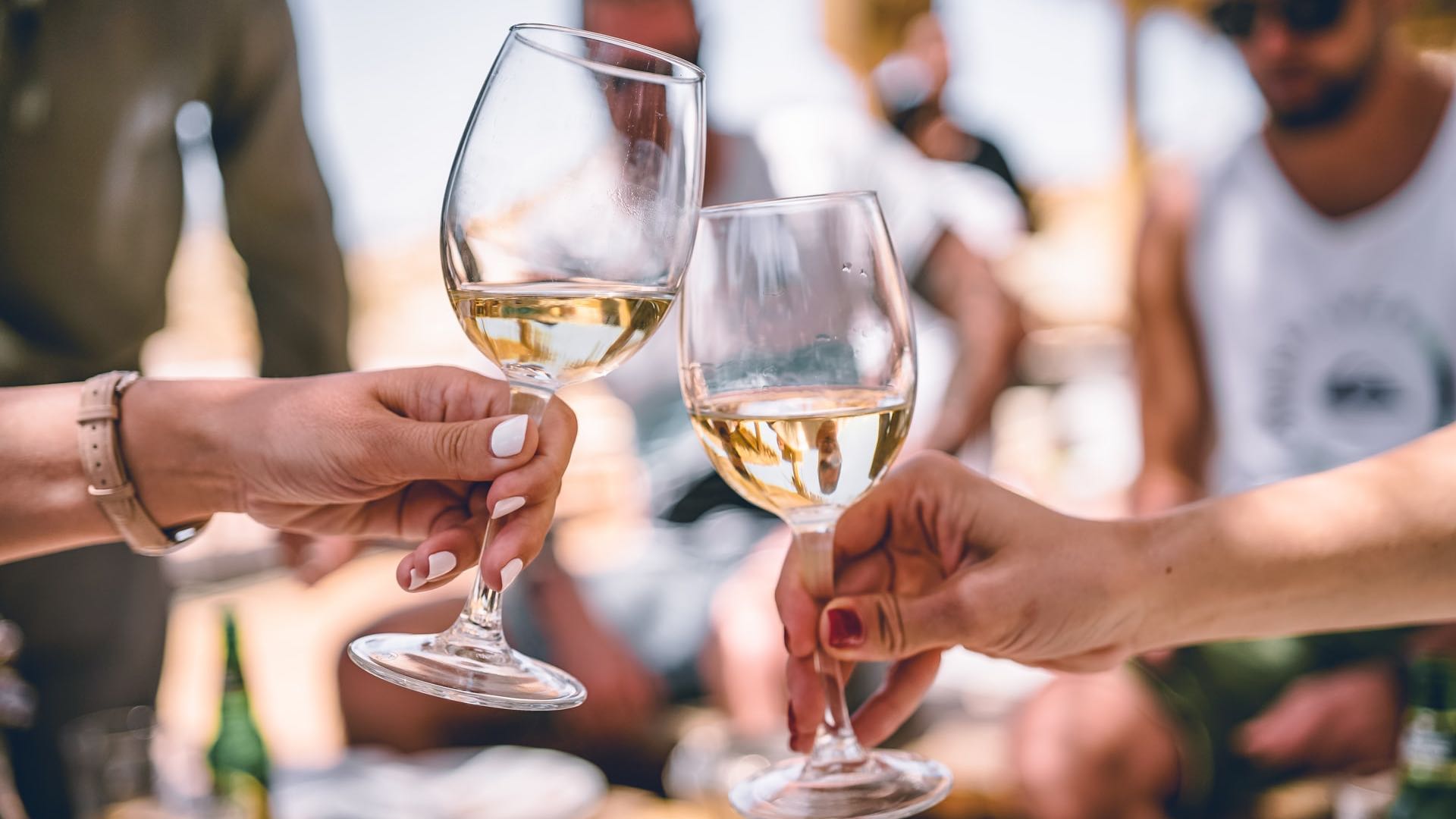 People Toasting with White Wine