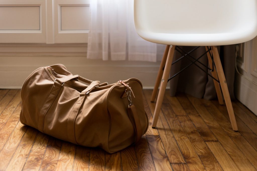 Brown Tan Leather Weekender Bag on the Floor