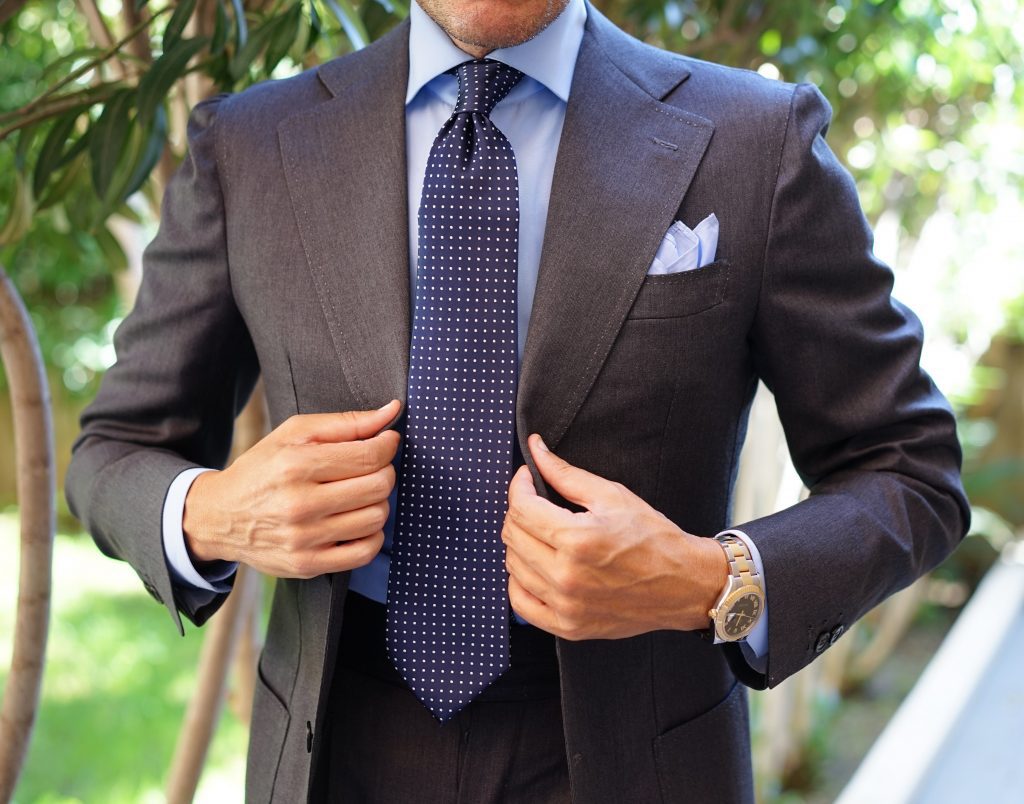 Suit Accessories: Man Wearing Charcoal Gray Suit with Blue Tie