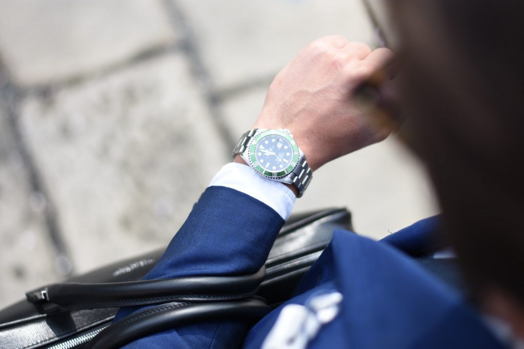 Man Wearing Blue Suit and Watch