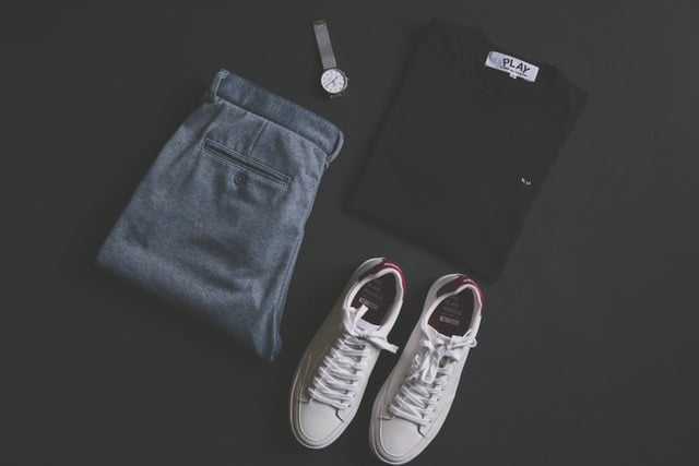 Outfit Flat Lay White Sneakers Blue Jeans and a Black Swatshirt