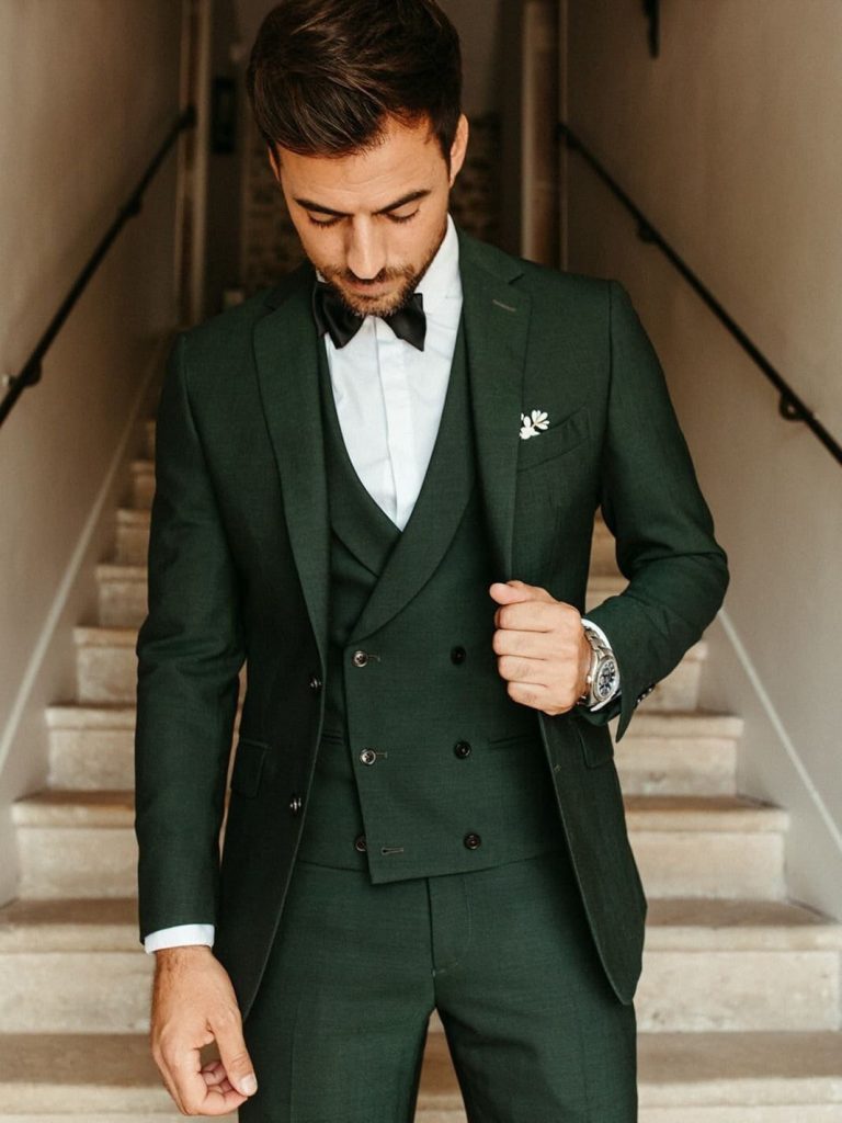 Man Wearing a Green Three Piece Suit for Wedding with Tie Bow and Pocket Square