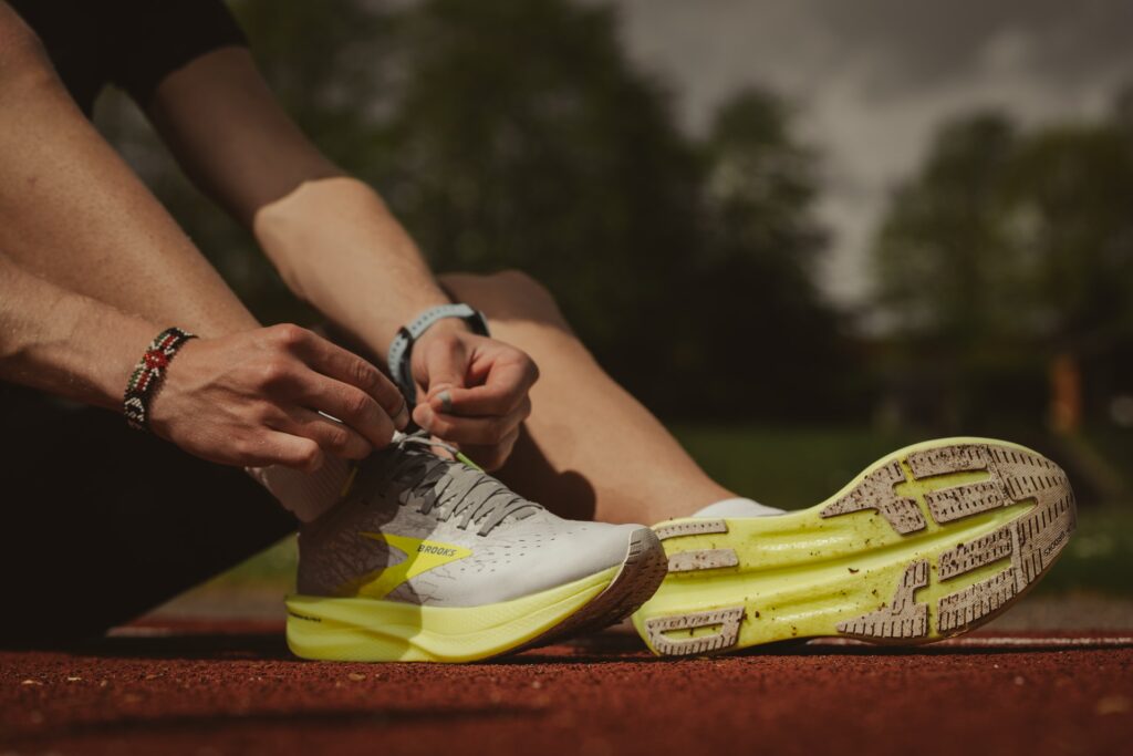 A Person Lacing Their Running Shoes