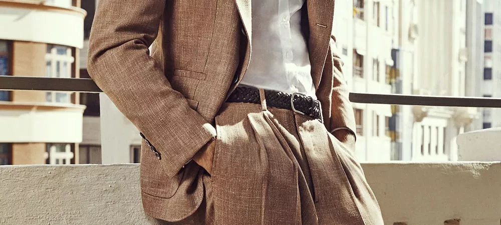 Man Wearing a Tan Suit with Belt