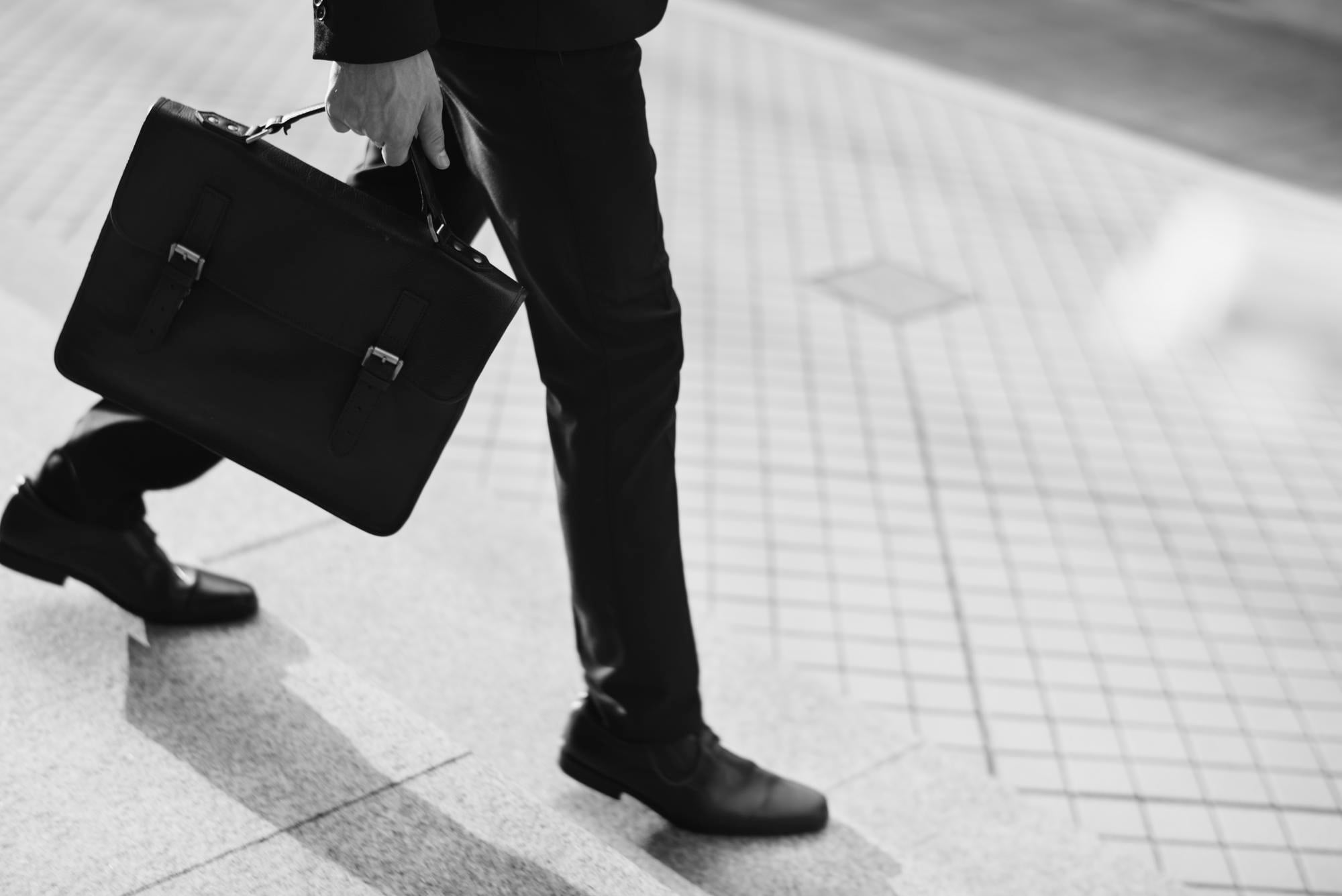 Business Man in Suit with a Bag Going to a Meeting